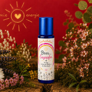 Aroma-Roll-on Brrr Eiszapfen aus der Serie Taschenhelden von Harmonie Energie, umgeben von getrockneten Kraeutern und Blueten