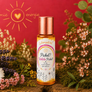 Aroma-Roll-on Pickel Welche Pickel aus der Beauty-Serie von Harmonie Energie, umgeben von getrockneten Kraeutern und Blueten